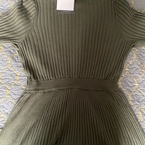 a green half necked dress